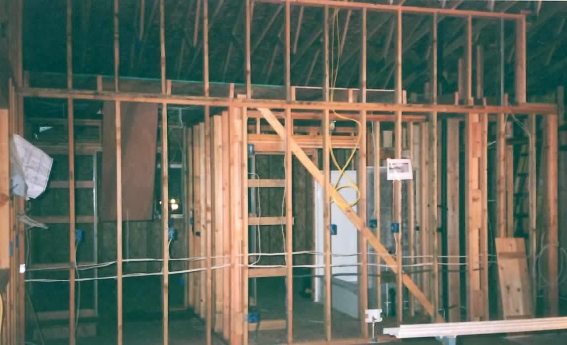 Electrical rough-in through open stud framing on a new build
